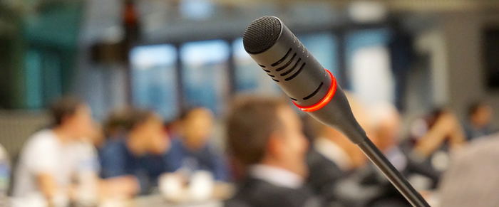 Microphone with blurred background of people